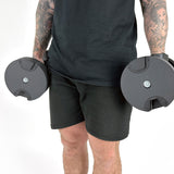 Fitness Model Using BRAINGAIN 45kg Round Adjustable Dumbbells Standing With Dumbbells By Side